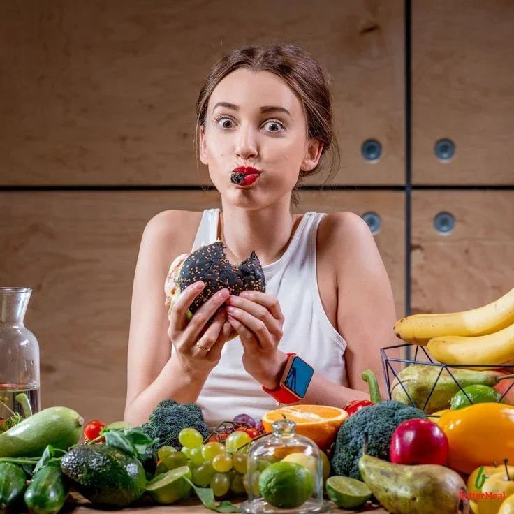 Woman enjoying plant-based burger at table with fresh fruits and vegetables, iPlantBased UAE