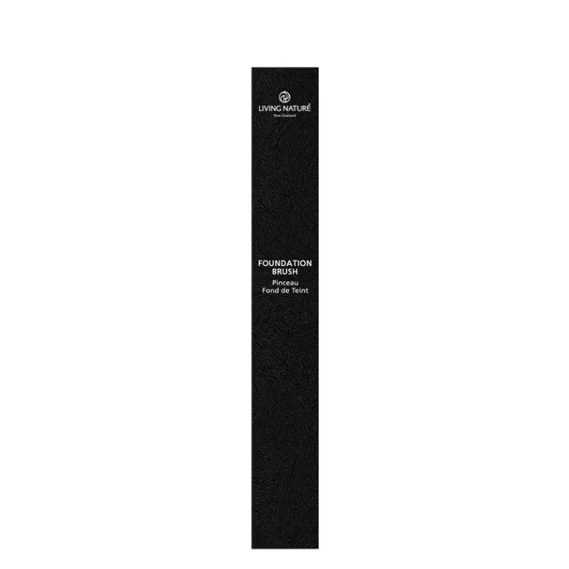 Black foundation brush packaging with 'Living Nature' branding on a white background
