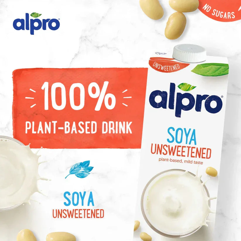 Alpro Soya Unsweetened 100% plant-based drink carton, soybeans, and splash on white background