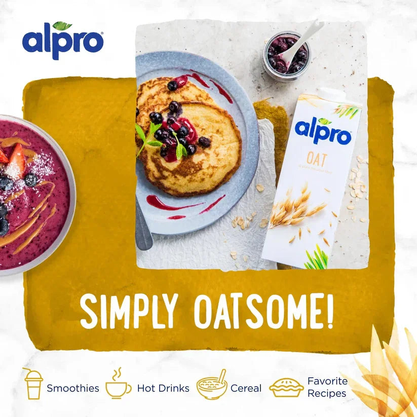 Alpro oat milk with pancakes, smoothie bowl, and berries, plant-based breakfast, iPlantBased UAE.
