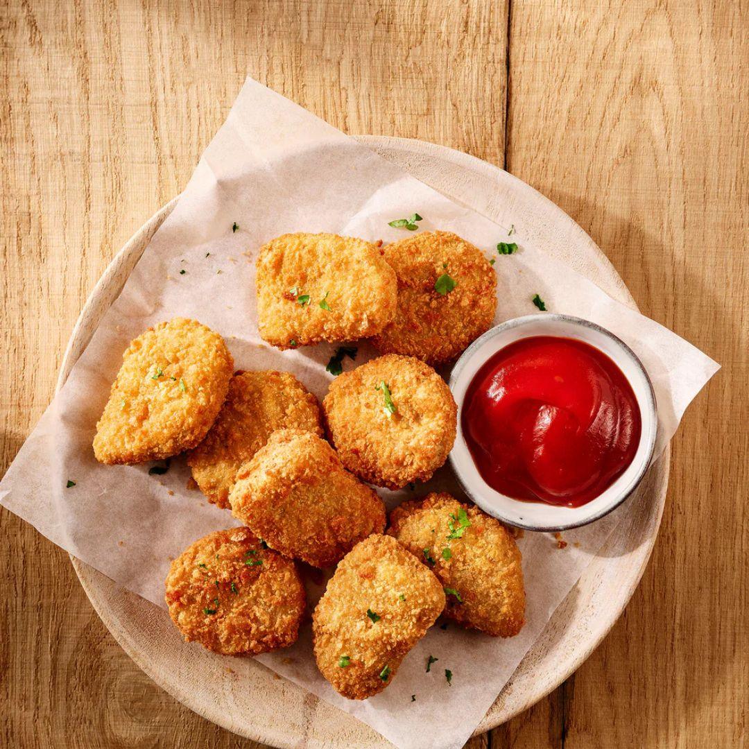 Crispy plant-based nuggets with ketchup on a plate, iPlantBased vegan snack food UAE