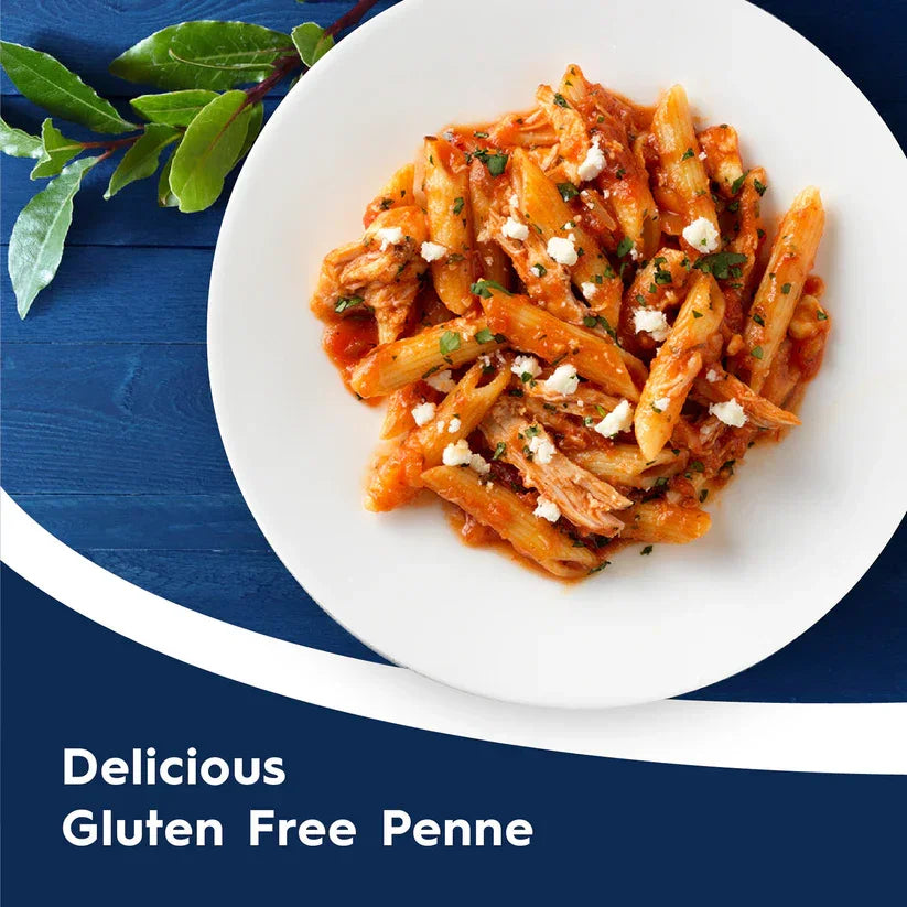 Gluten free penne pasta with tomato sauce and herbs on white plate, iPlantBased UAE