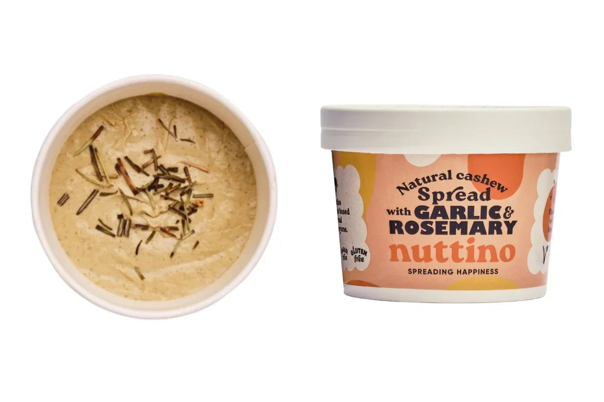 Nuttino natural cashew spread with garlic and rosemary in a tub, plant-based food UAE