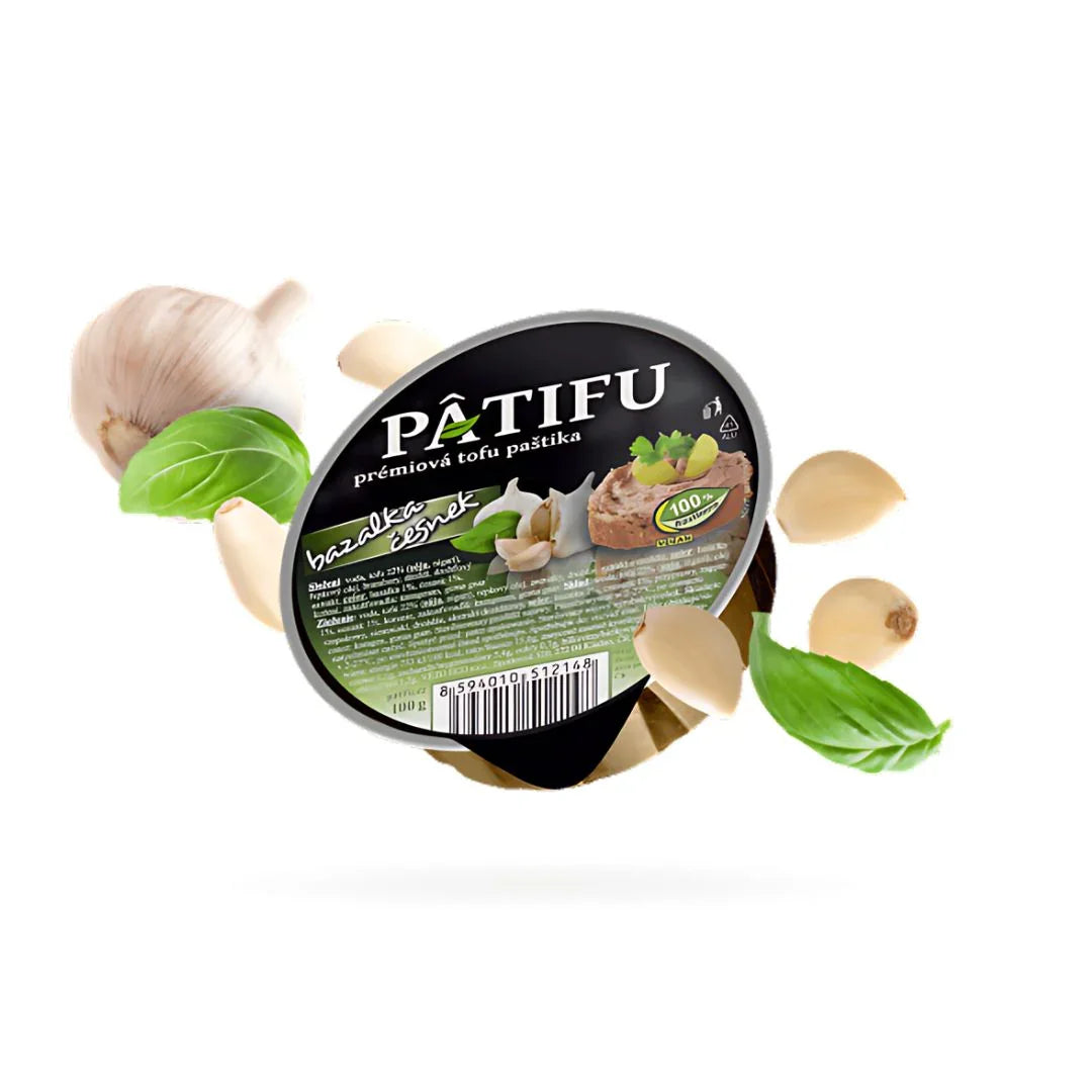 Patifu plant-based tofu spread with basil and garlic, surrounded by fresh basil leaves and garlic cloves, vegan food UAE
