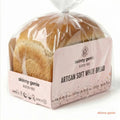 Packaged loaf of artisan soft white bread with 'skinny genie' branding on a white background