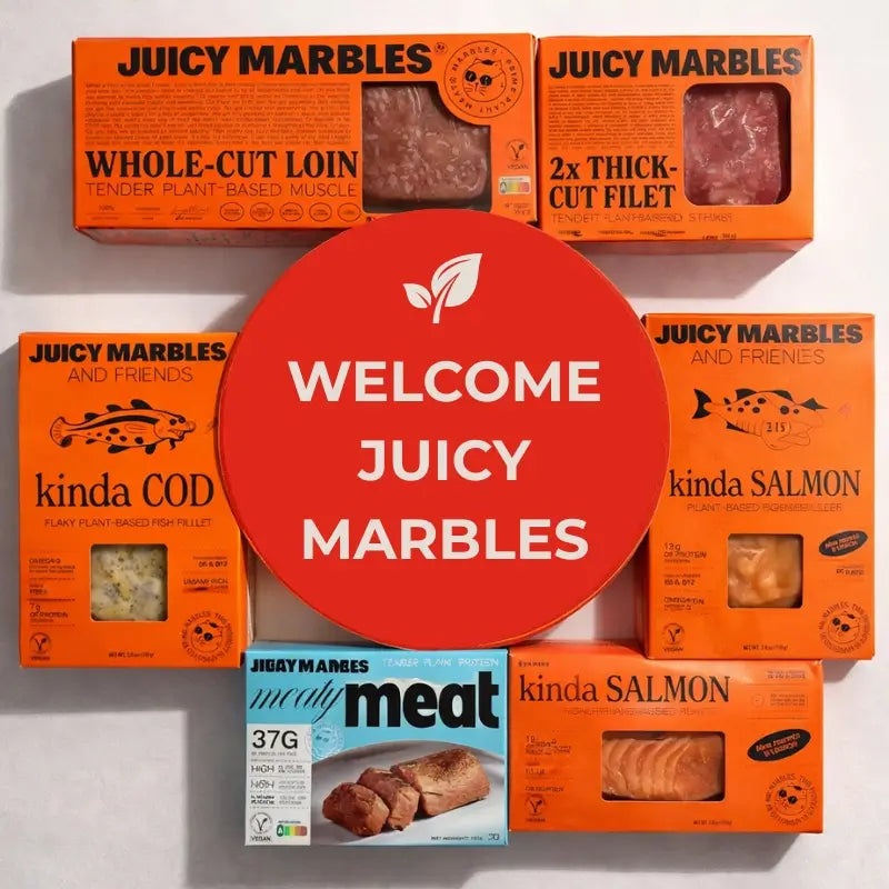Collection of Juicy Marbles product boxes with a 'Welcome Juicy Marbles' sign.