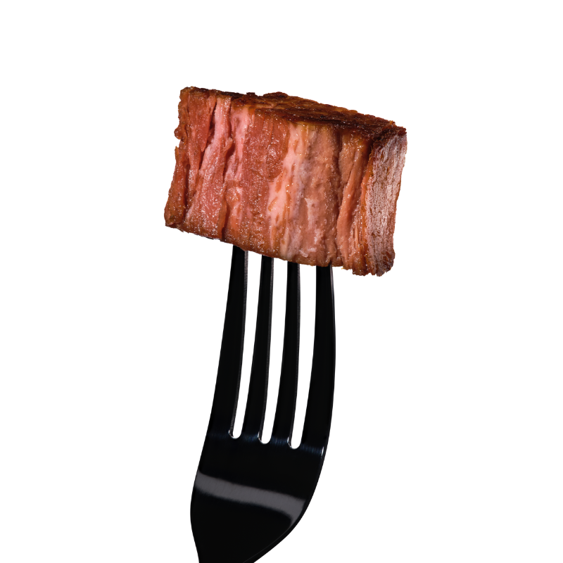Black fork holding a piece of cooked juicy marbles meat on a white background