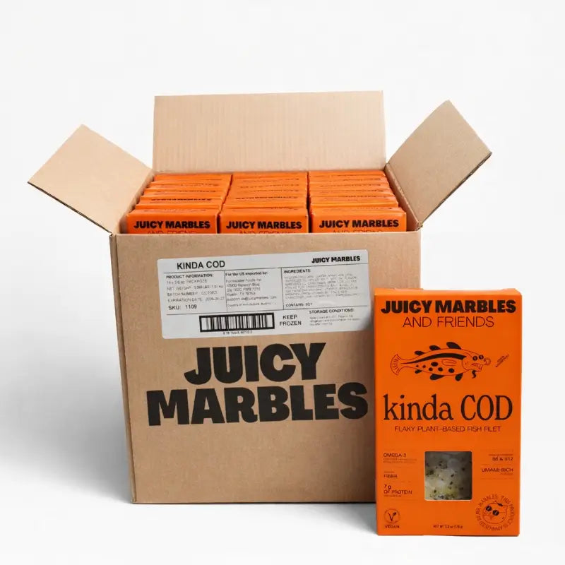 Open cardboard box with multiple boxes of 'Juicy Marbles' and a single 'kinda COD' on a white background.