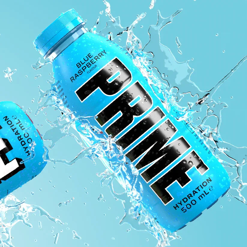 Blue raspberry PRIME hydration drink bottle with water splash, refreshing beverage